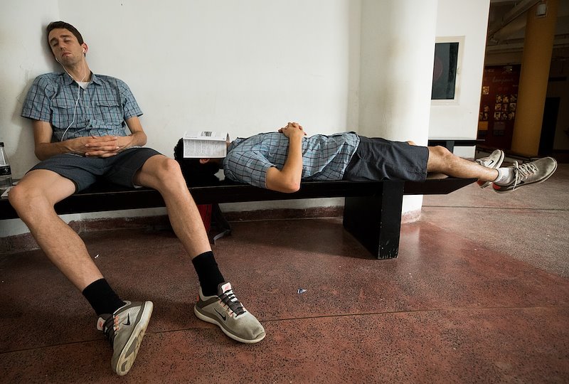 Weary tourists take a moment to catch up on some sleep at the Vietnam Museum of Ethnology. Photo by Jaren Wilkey/BYU