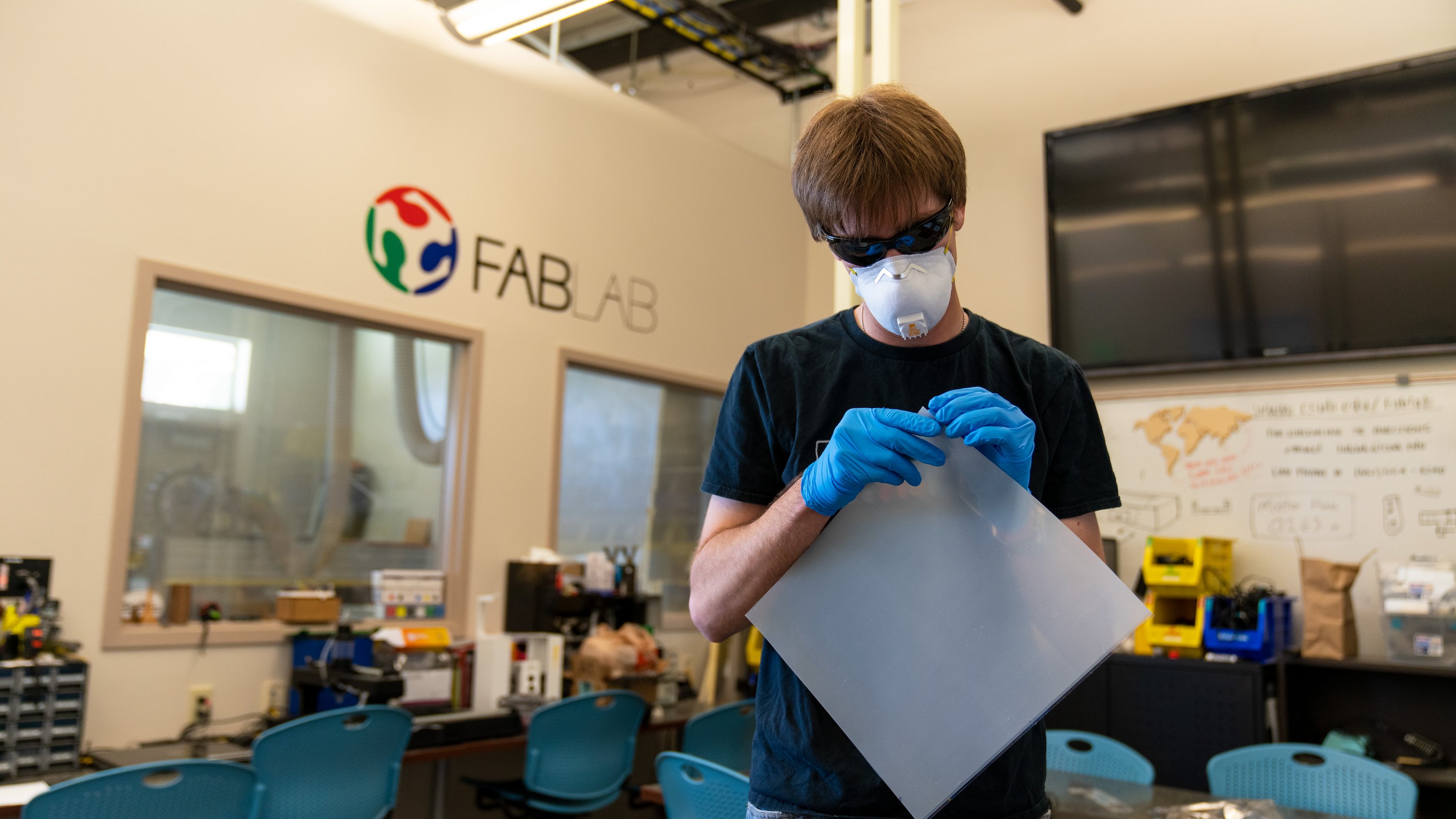 Former Fab Lab specialist Bobby Hartsock works on masks during the ...