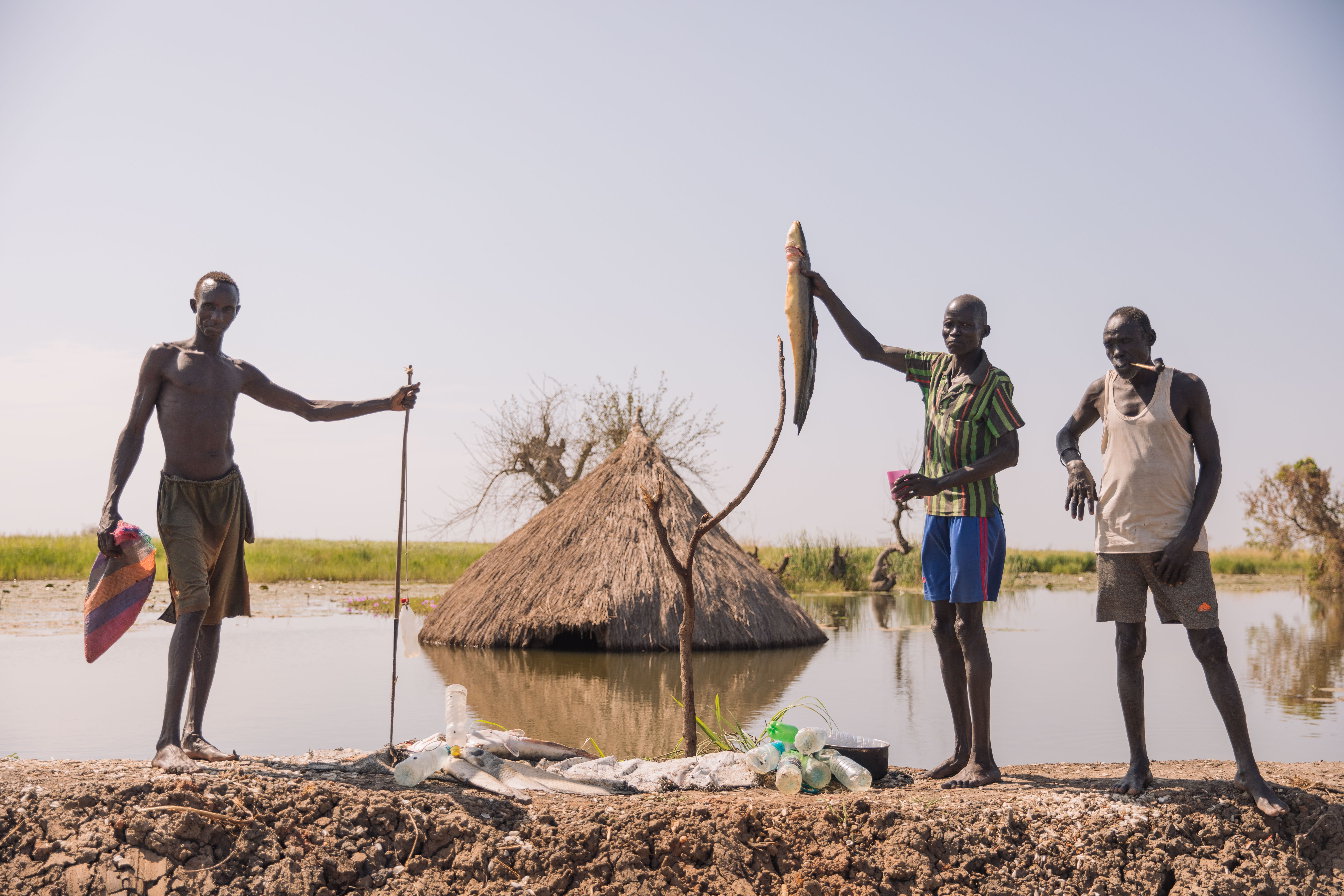 Fishermen display their catch in Rubkona town, Unity State. The hut ...