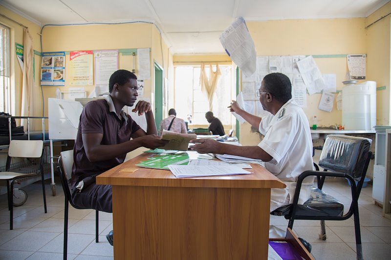 A patient receives instructions from a clinician at the OI clinic at St. Albert’s Mission Hospital.