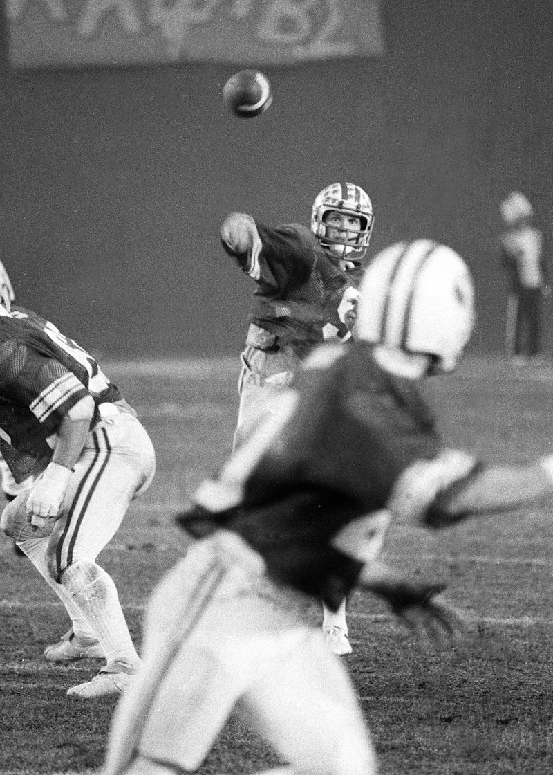 Jim McMahon making a pass in the 1980 Holiday Bowl.