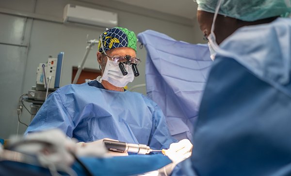 Dr. Venter is "repairing" our patient's fingers and hand!