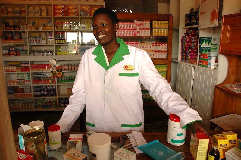 A young, accredited pharmacist provides safe drugs for their community in Uganda. (Photo: Glenn Ruga)