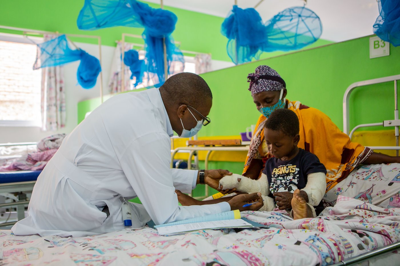 Dr. Lubega meets with Ernest.