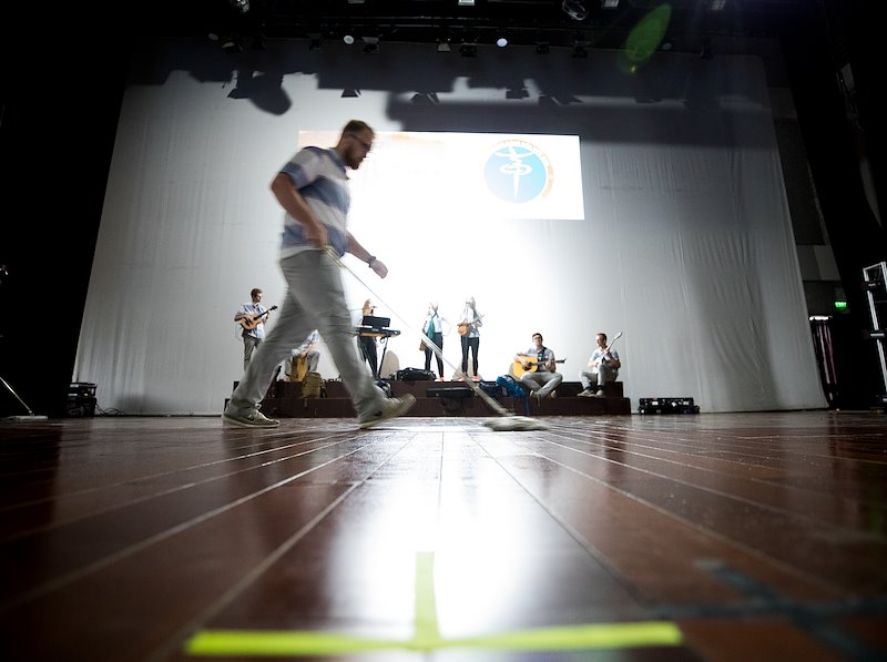 Sweeping the stage as BYU prepares for a performance at the Vietnam Dance Academy. Photo by Jaren Wilkey/BYU