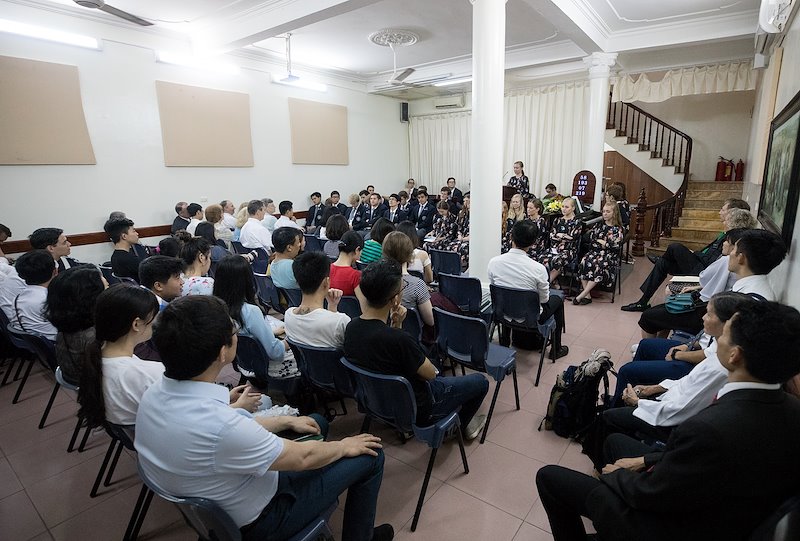 BYU Students speak at a devotional put on for members from branches in Hanoi. Photo by Jaren Wilkey/BYU