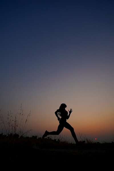 Vivica Thomas runs on a path at Woodward Park.