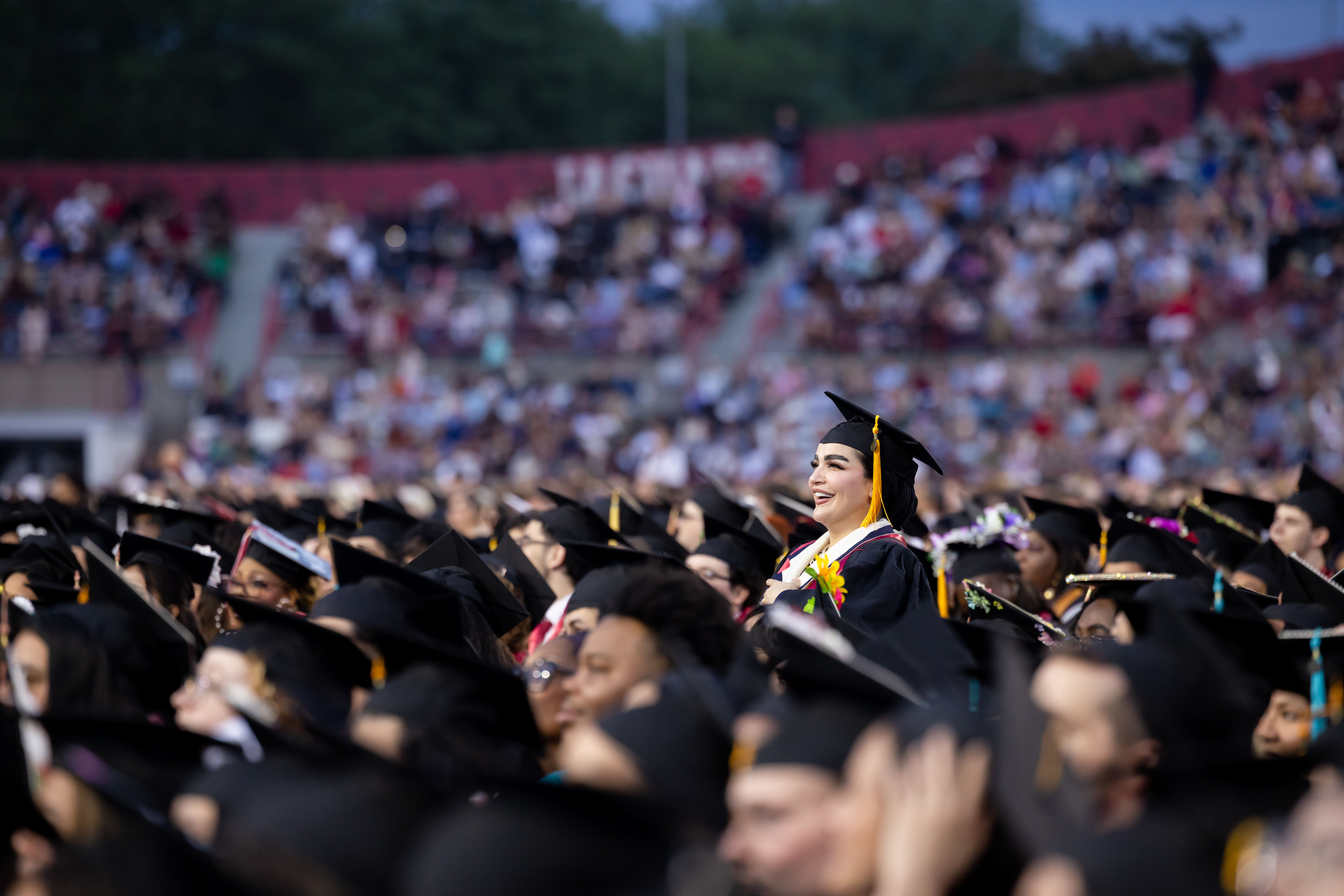 A graduate stands during the IU Indianapolis Commencement on Saturday ...