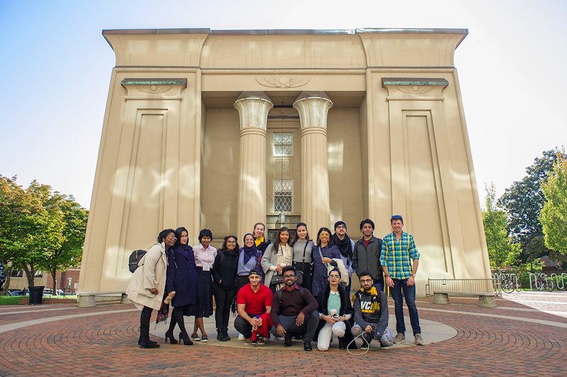 The delegation from Qatar poses for a group photo in front of the Egyptian Building. Photo by Kevin Morley, VCU University Relations.