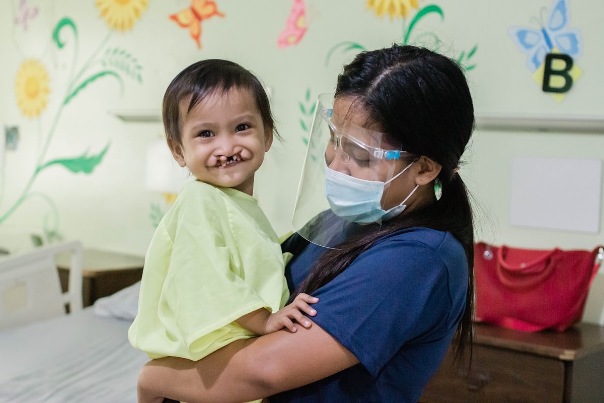 Sweet Aizelle is happy and excited to become cleft-free as she waits to go down to the operating room.