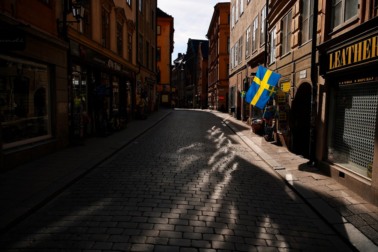 Swedish flags fly from a tourist souvenir shop in Gamla Stan in Stockholm, Sweden, on Thursday, March 26, 2020.