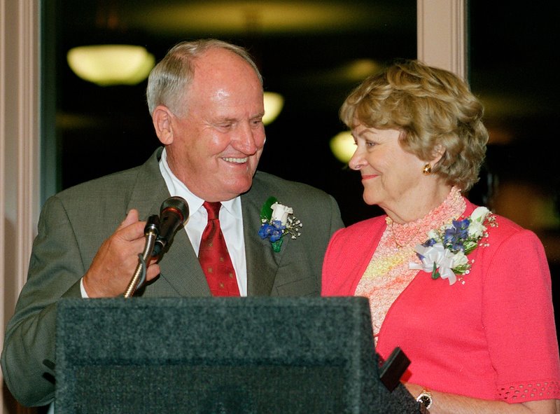 LaVell and Patti speak together at a dinner after his retirement.