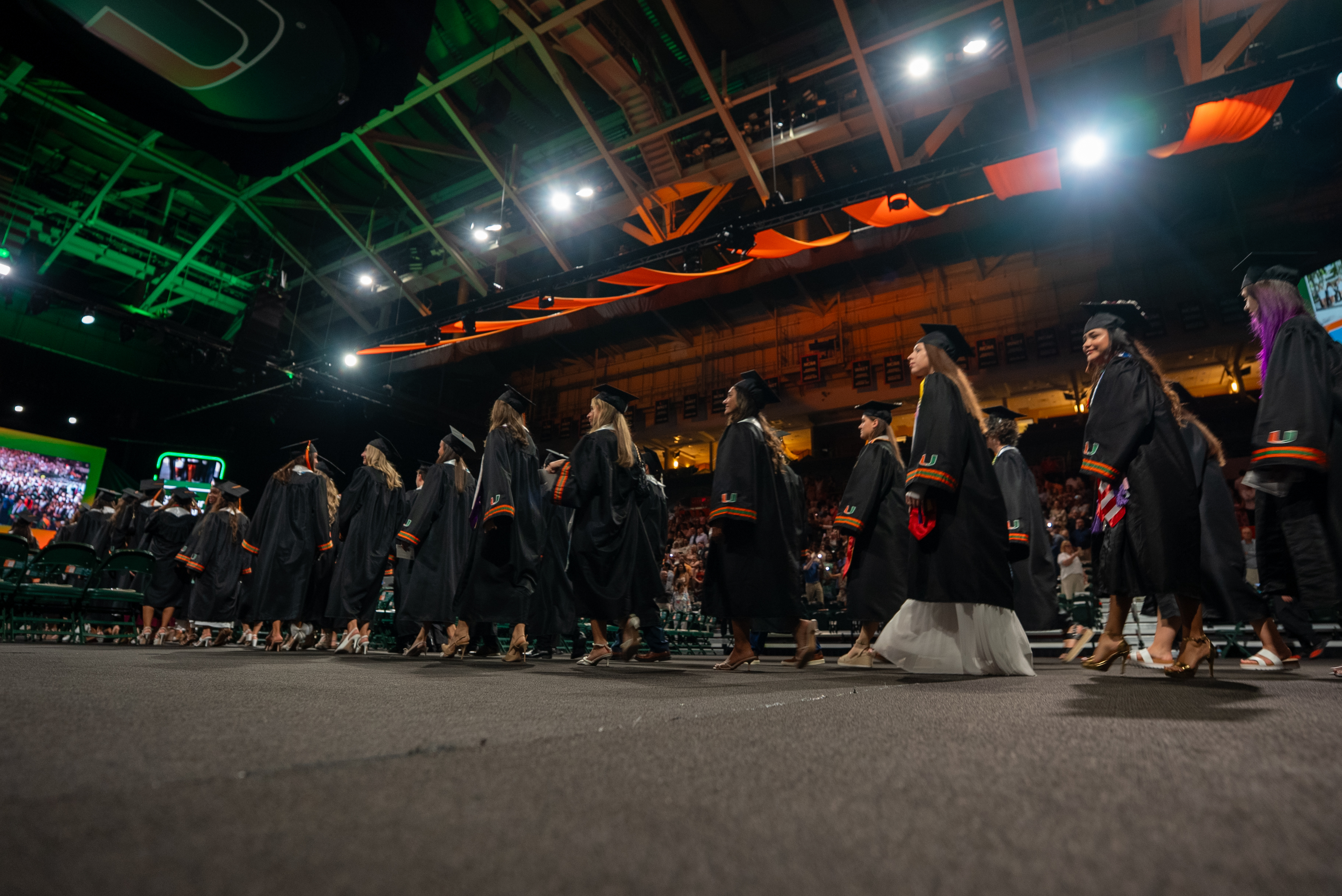 Graduates in caps and gowns walk at the Spring 2026 Commencement ...