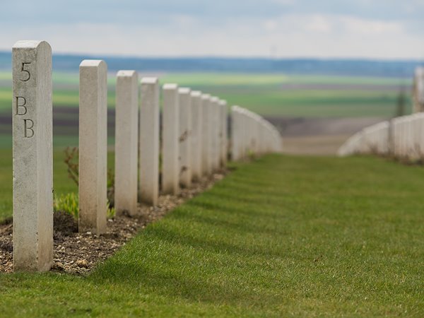 Lines of headstones at the Australian National Memorial honor soldiers in the French countryside.
