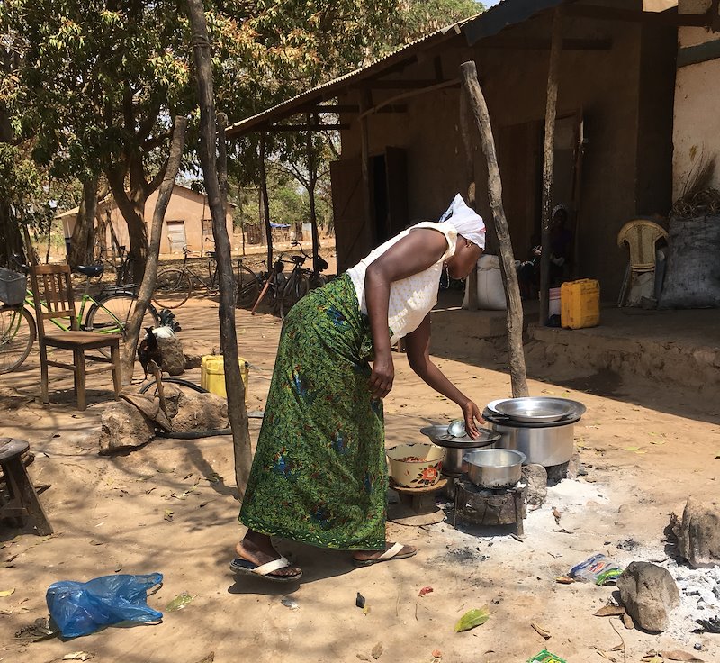Business woman preparing food at her restaurant in the village