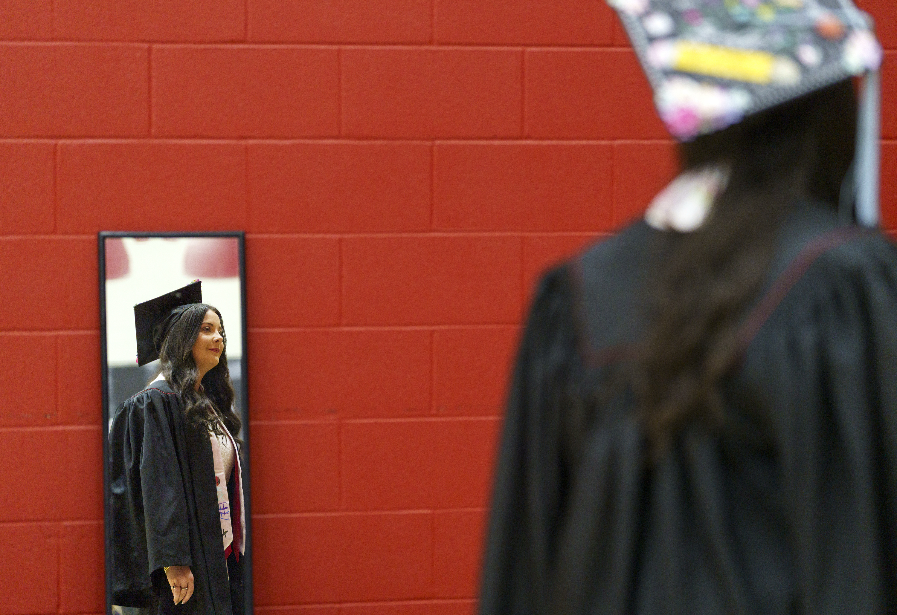 Tristen Collins in reflected in a mirror while preparing to line up for ...