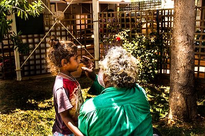 Jack painting daughter Jackie Green's face before the Peter Rawlinson Award ceremony, Borroloola, NT