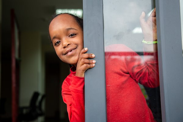 Meriyem peeking through the door.