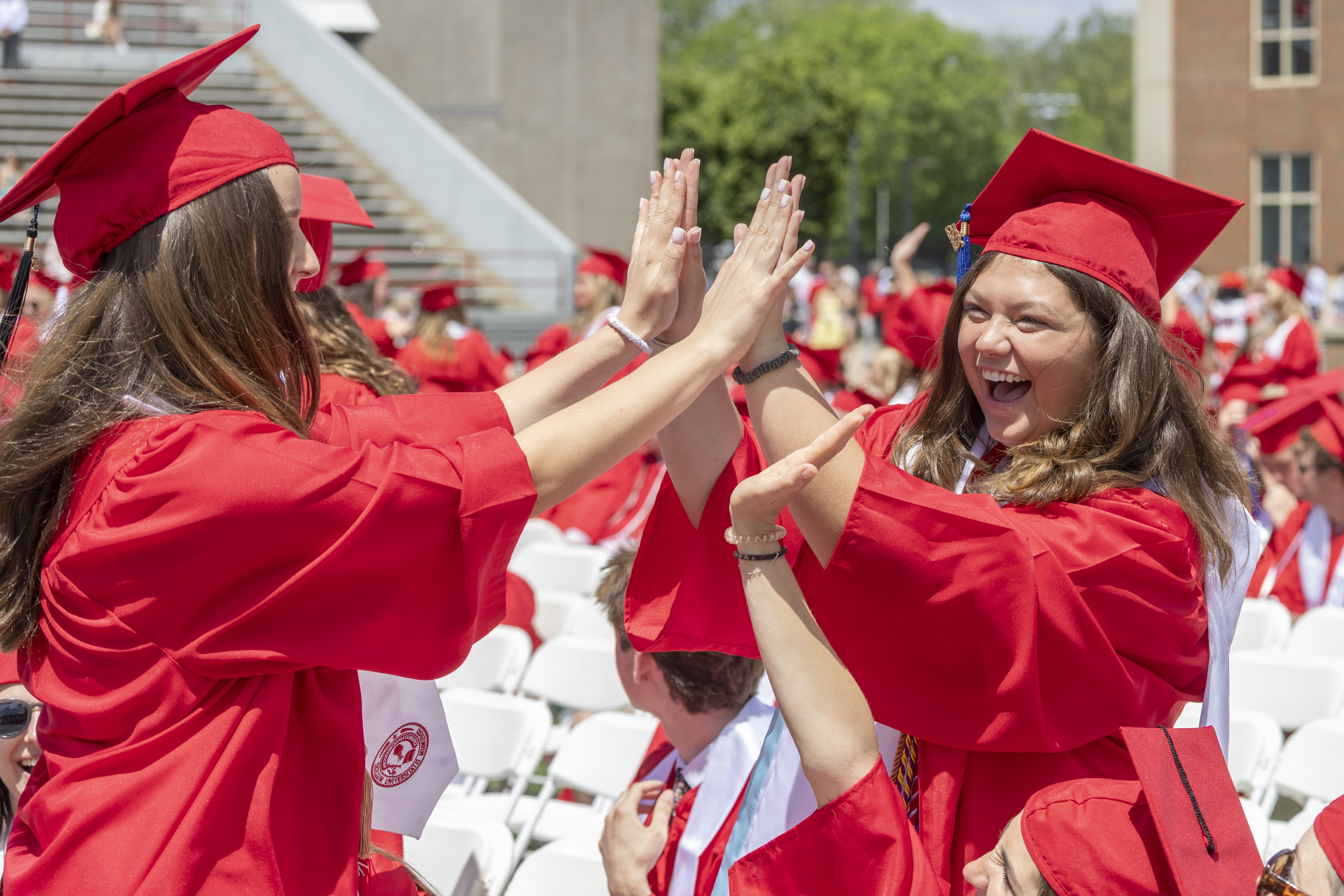 Miami University students celebrate during spring commencement at Yager ...