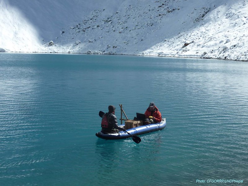 File photo from 2014: Scientists measuring depth of a supra lake on the side of Imja glacier.