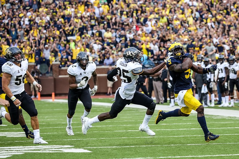 The Michigan Stadium crowd jumps to their feet as Jabrill Peppers breaks tackles on his way to a long punt return.