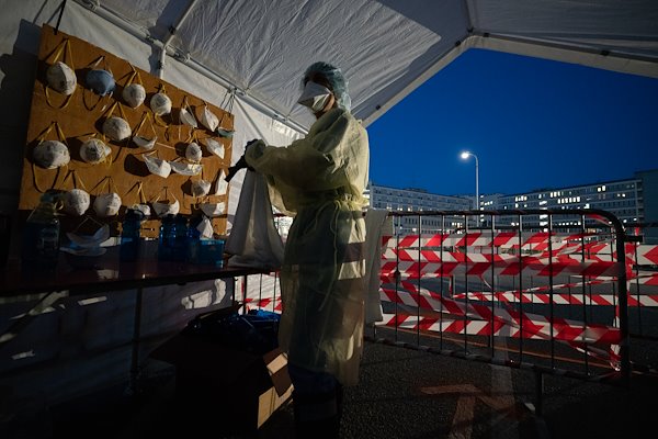 "Clean zone" masks are hung to be reused by staff who enter the "hot zone." The worldwide PPE requirements and shortages have created a need to reuse a mask for multiple days, unless it has been used in direct patient contact.