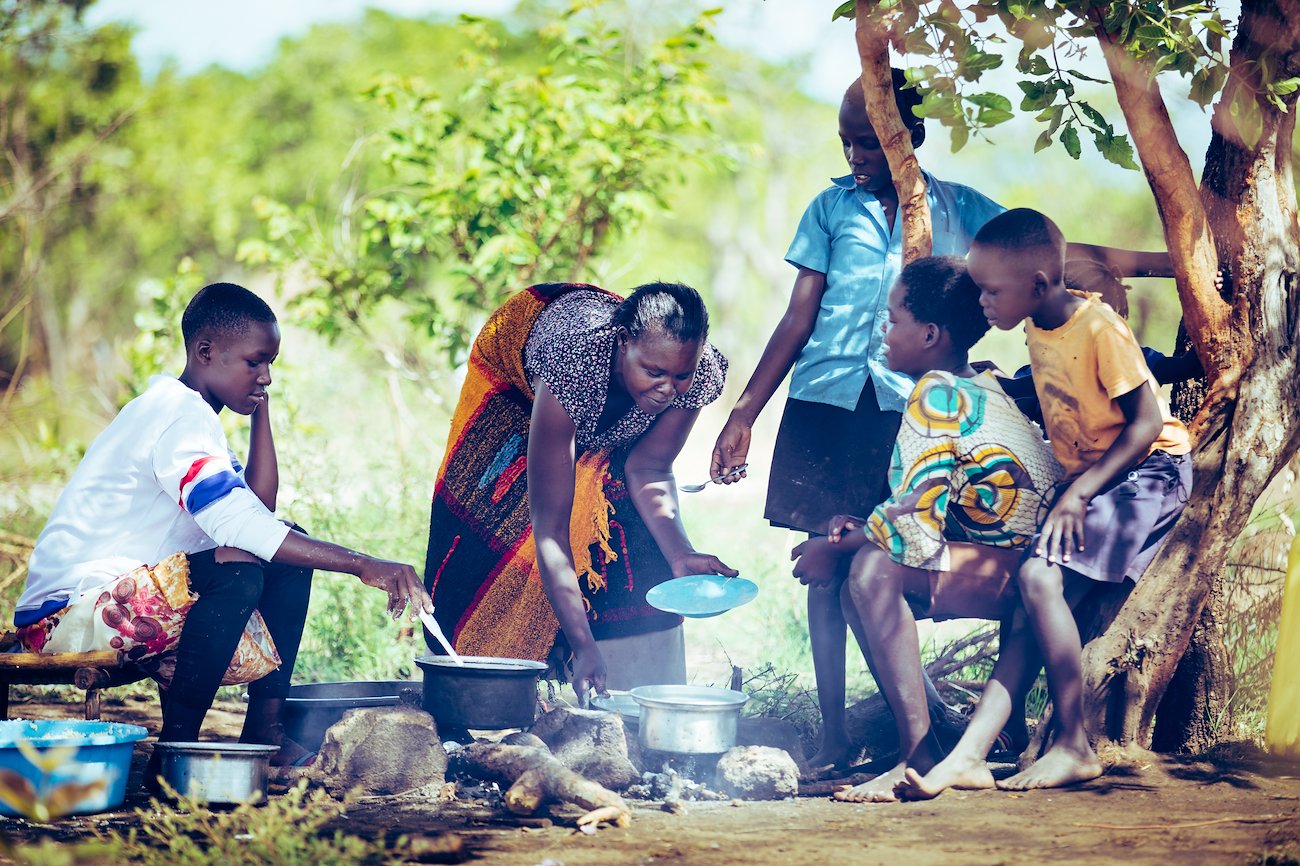 Neena with her children and the orphaned children she has adopted.