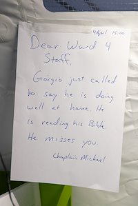 A note from Giorgio hangs in the male ward where he received care.