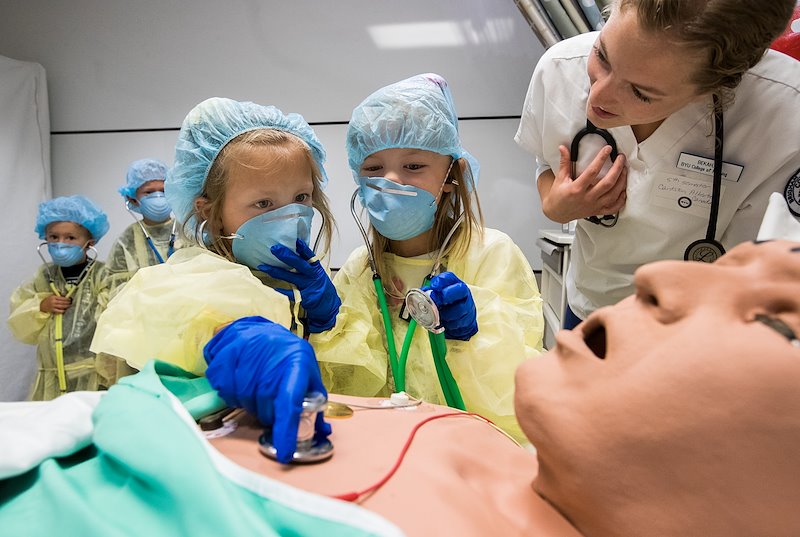 Kids get hands-on experience in the nursing lab during an open house - Photo by Jaren Wilkey/BYU