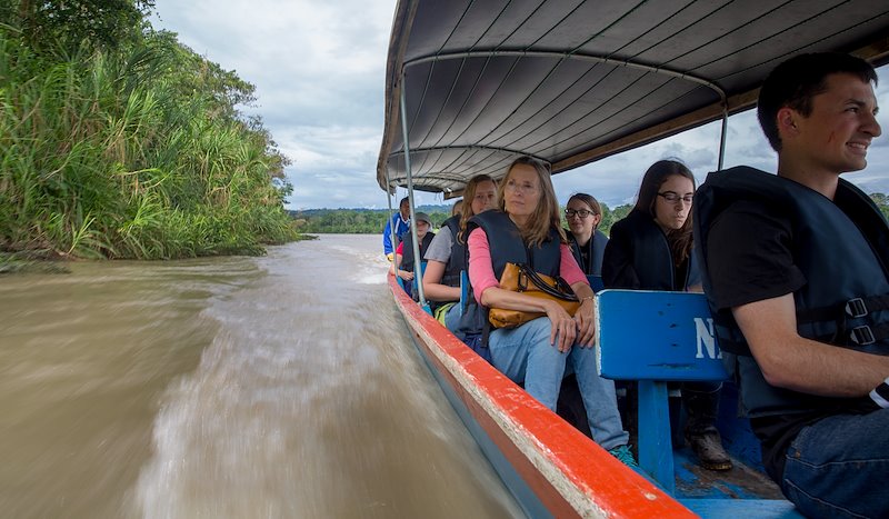Students travel down the Napo river to visit a local farm.