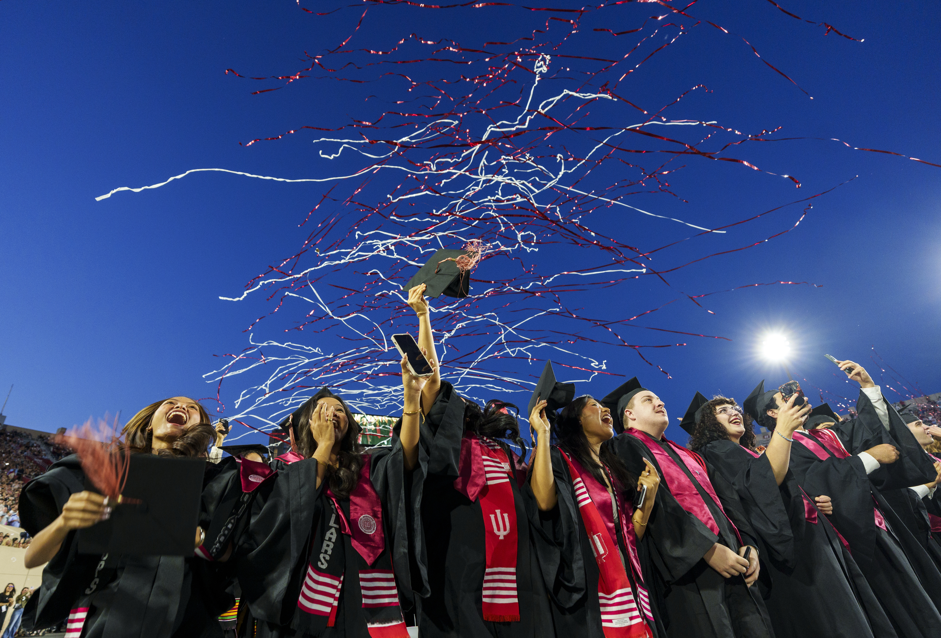 Streamers fly overhead as joyous grads celebrate during the IU ...