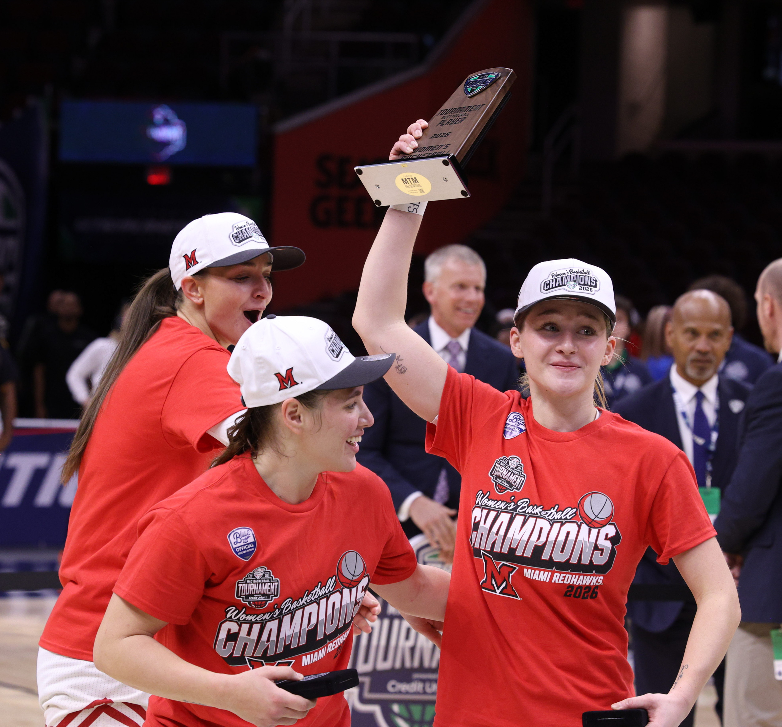Three Miami Redhawks players celebrate winning the 2026 MAC Tournament ...