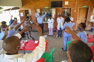 Staff members prayed a blessing over Dr. Agatha and Dr. Noah, as they go for further studies.