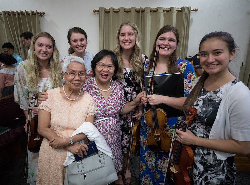 Local members pose with BYU Students after a fireside at the Aurora Chapel in Quezon City. Photo by Jaren Wilkey