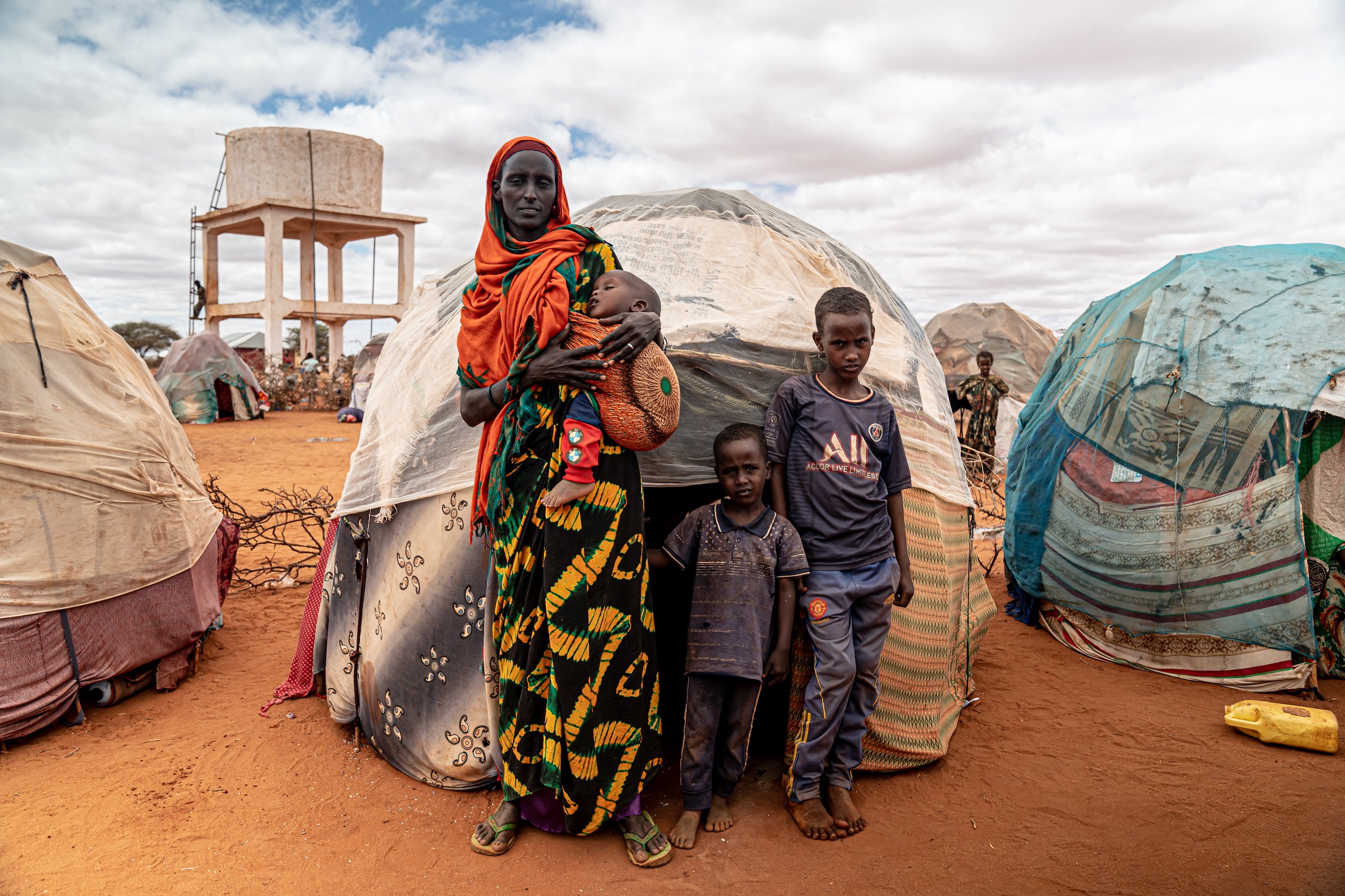 Muumino and her children in front of their makeshift home in the Kaharey settlement in Doolow.