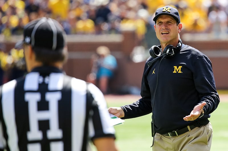 Outscoring Hawaii by several touchdowns, head coach Jim Harbaugh still argues with referees.