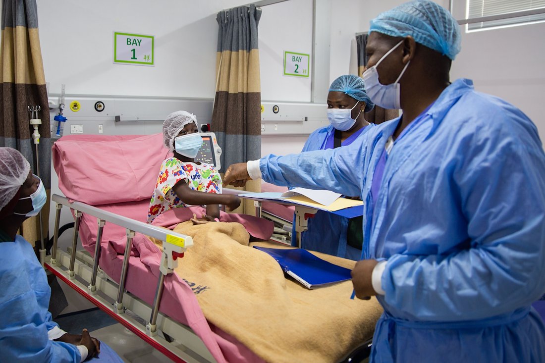 Nurse Philani greets Tamia while she waits to enter the OR.