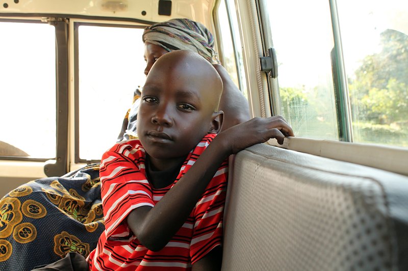 Emmanuel travelling to the Benedictine Eye Hospital in the Sightsavers project vehicle.