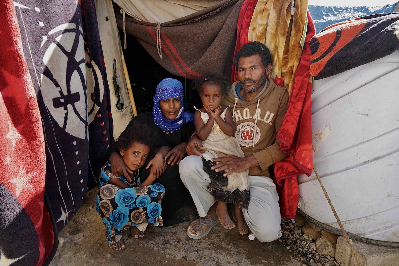 Al Fajr school, Al Turbah. Fazal, Fatima and their children in front of their tent. The family has lived here for the past five years after being displaced from Taiz city in 2015. ©UNOCHA/Giles Clarke