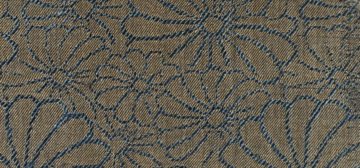 Close-up of textile sample with repeating floral pattern; blue floral ...