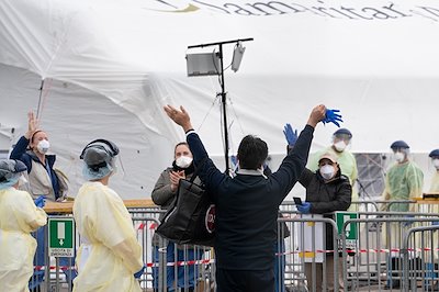 Massimo waves to translators and other staff as he is discharged.