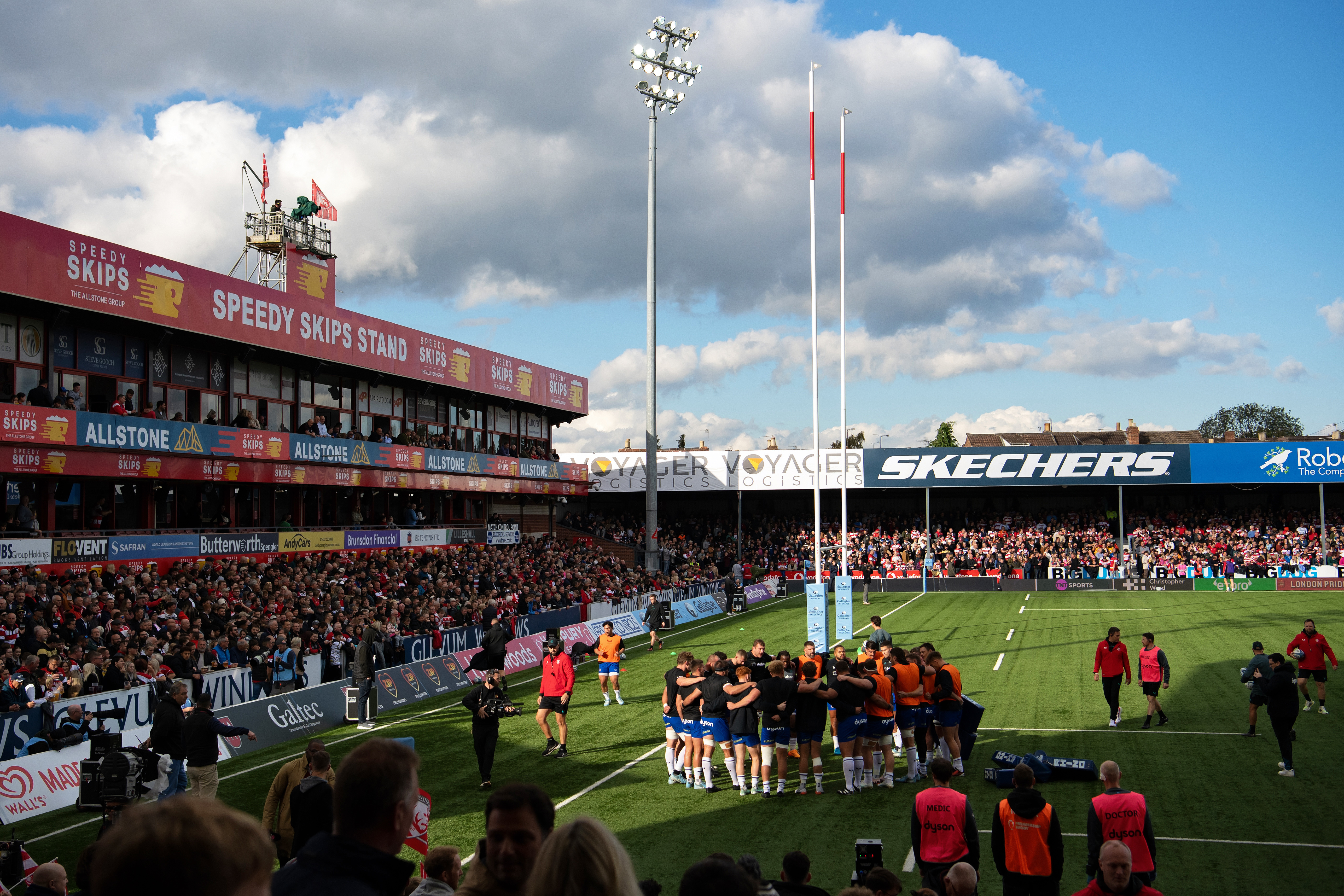 The Bath Rugby team huddle together during the pre-match warm-up ...