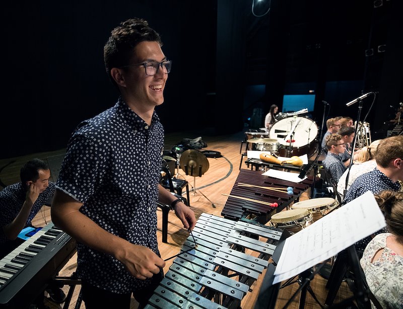 BYU Chamber Orchestra member Grant Taylor playing the xylophone. Photo by Jaren Wilkey/BYU