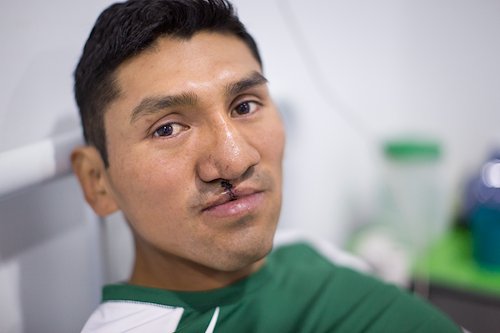 After surgery, Edson started reading the new Spanish Bible he received from our ministry team.