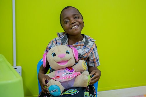 Wasili with a new friend! Wasili loves to play with the dolls!