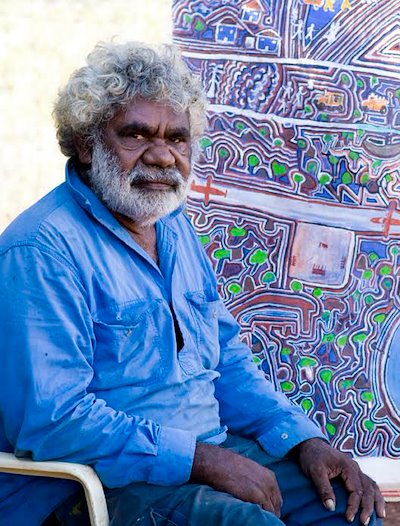 Jacky Wongili Green with his painting: 'Trying to Protect Our Land'