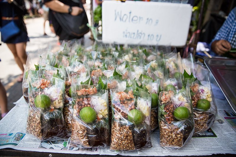 A personal favorite, miang kham, is toasted coconut, lime, sugar sauce, peanuts, ginger, onion, peppers and dried shrimp wrapped in a leaf.