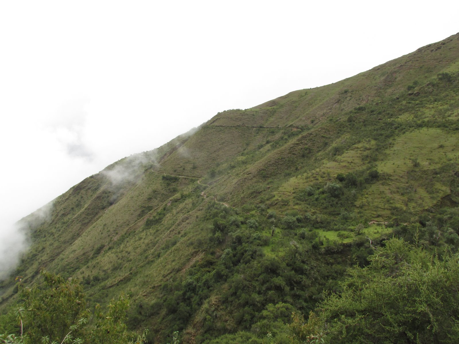 The trail is visible, cut into the steep terrain