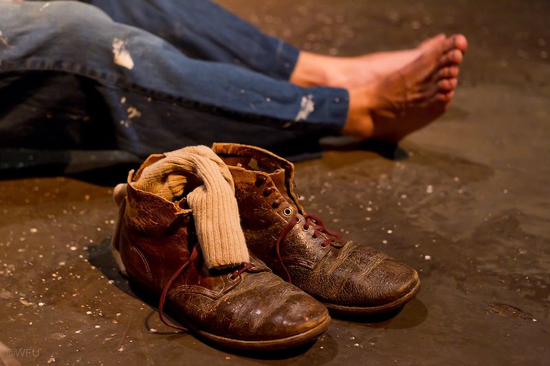 Worn farm shoes symbolize the plight of he Judd family in "The Grapes of Wrath."