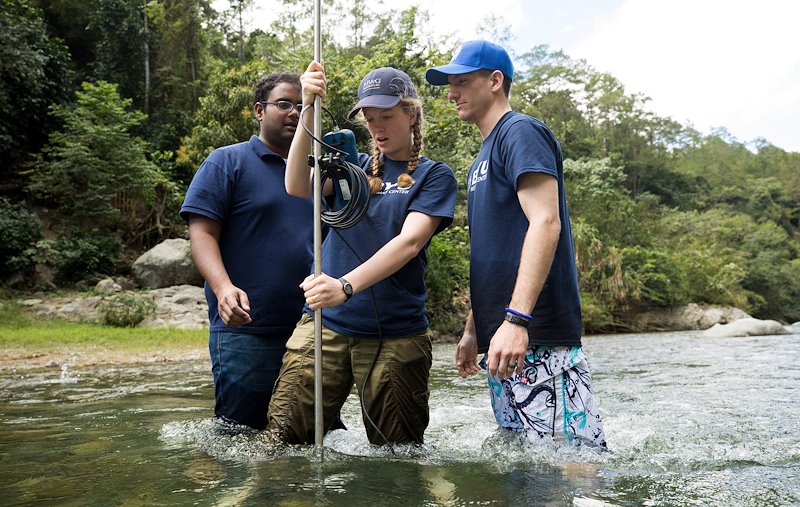Sarva Pulla, Annie Nielson and Hayden Schappell learn how to measure stream flow in the Yaque del Norte River. Photo by Jaren Wilkey/BYU